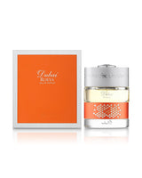spirit of dubai roeya perfume bottle shows beside its packaging against white background