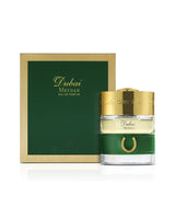 spirit of dubai meydan perfume bottle shows beside its packaging against white background