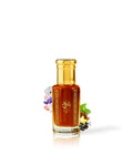 sweet rock perfume oil bottle surrounded with fragrance notes like marshmallow and caramel against white background