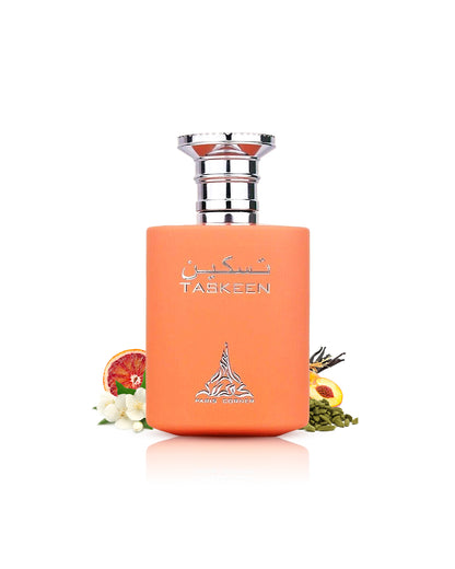 paris corner taskeen perfume bottle surrounded with its ingredients like jasmine and cardamom shows from behind the bottle against white background