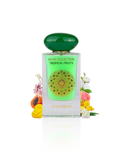 tropical fruits musk by gulf orchid perfume bottle surrounded with its ingredients like mango and papaya with many other fruits shows from behind the bottle  against white background