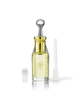 venus perfume oil bottle with a shiny gold neck and silver dropper cap, shown on a white background with a small white cap off to the left and a white applicator tube to the right.