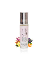 A 10ml roll-on perfume bottle by Yara, featuring a silver metallic cap and a pale pink label with Arabic calligraphy. The bottle is styled with small flowers and citrus slices at its base against a clean white background.