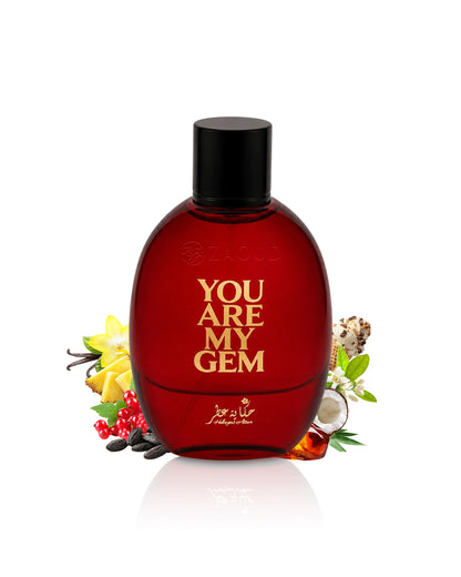 you are my gem perfume bottle surrounded with fragranc enotes like amber fruits  shows against white background