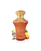 Zimaya ANHAAR DUNE perfume bottle surrounded by coconut and caramel shows against white background