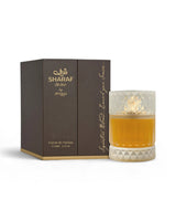 zimaya sharaf divine perfume bottle shows beside its packaging against white background