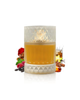 zimaya sharaf divine perfume bottle surrounded by fragrance notes like raspberry and amber shows against white background