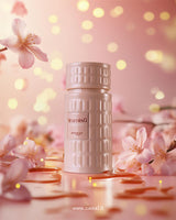 zimaya tiramisu caramel perfume bottle photograph over reflected surface eith liquid caramel and with Orchid flowers around 